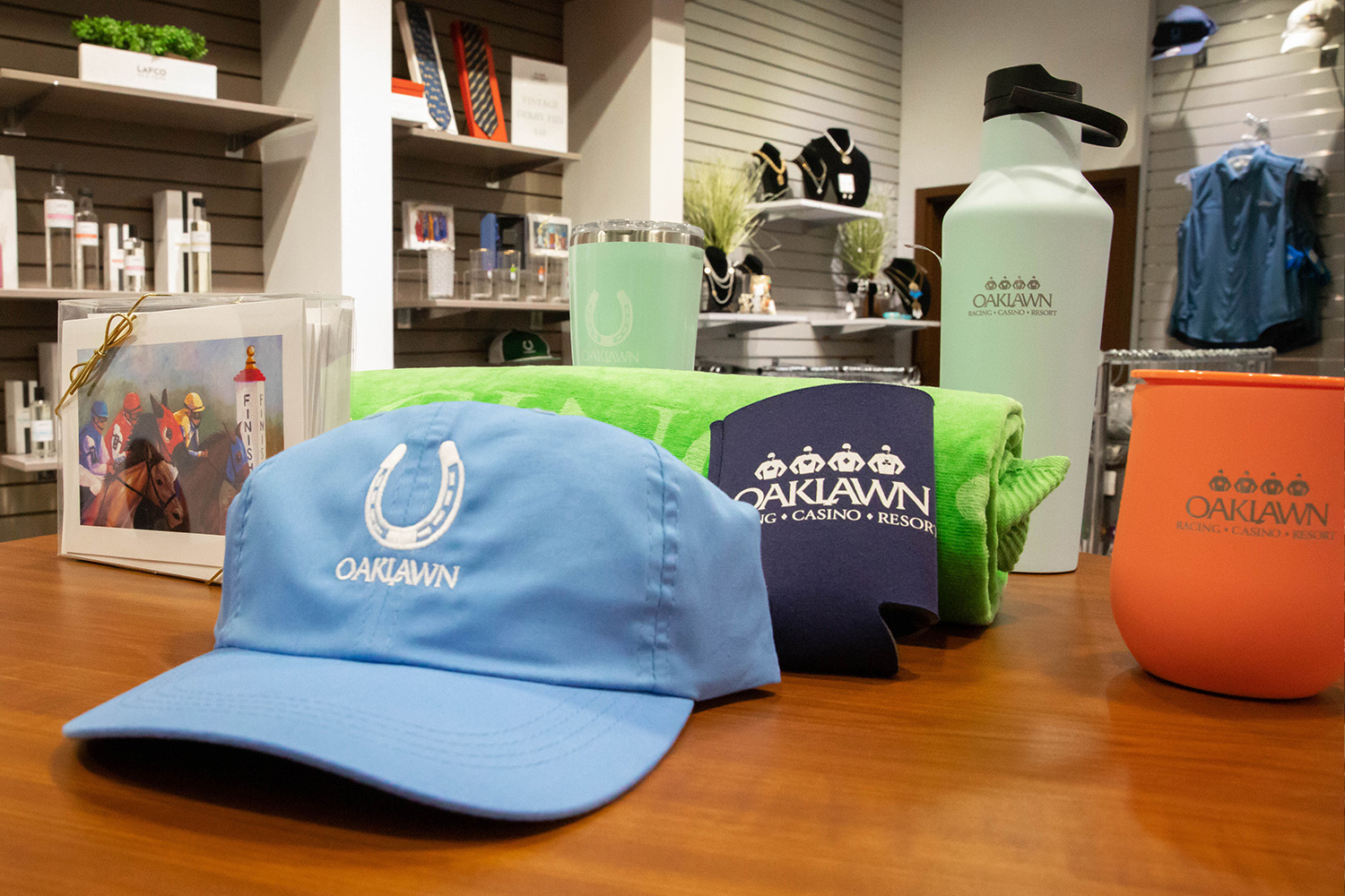 Casino Gift Shop displaying Oaklawn hats, mugs, postcards, glassware and other merchandise